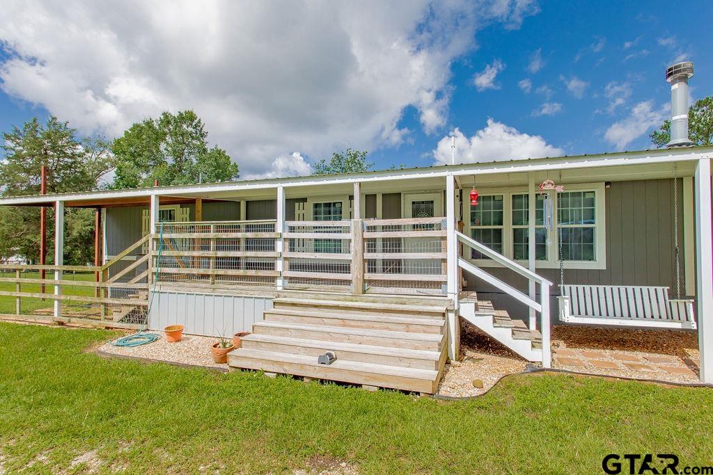 636 Roberson Road Hallsville, TX 75650 - Photo 15 of 46 a view of a house with a backyard