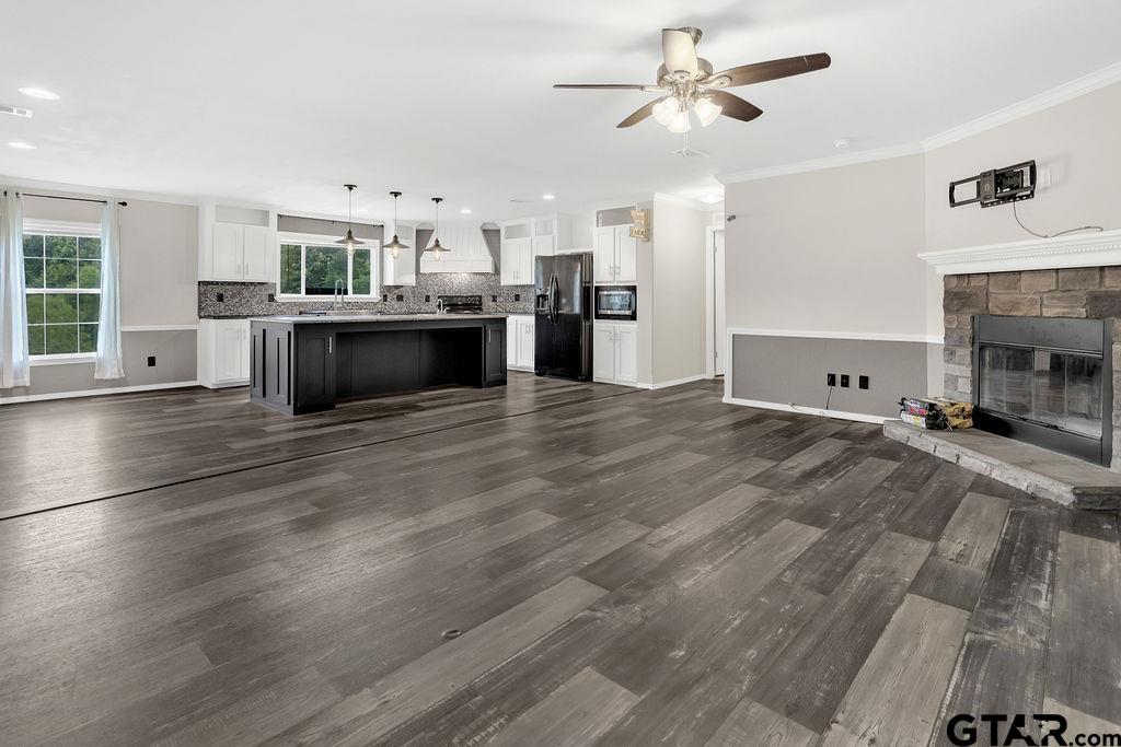 636 Roberson Road Hallsville, TX 75650 - Photo 18 of 46 a view of kitchen with cabinets and wooden floor