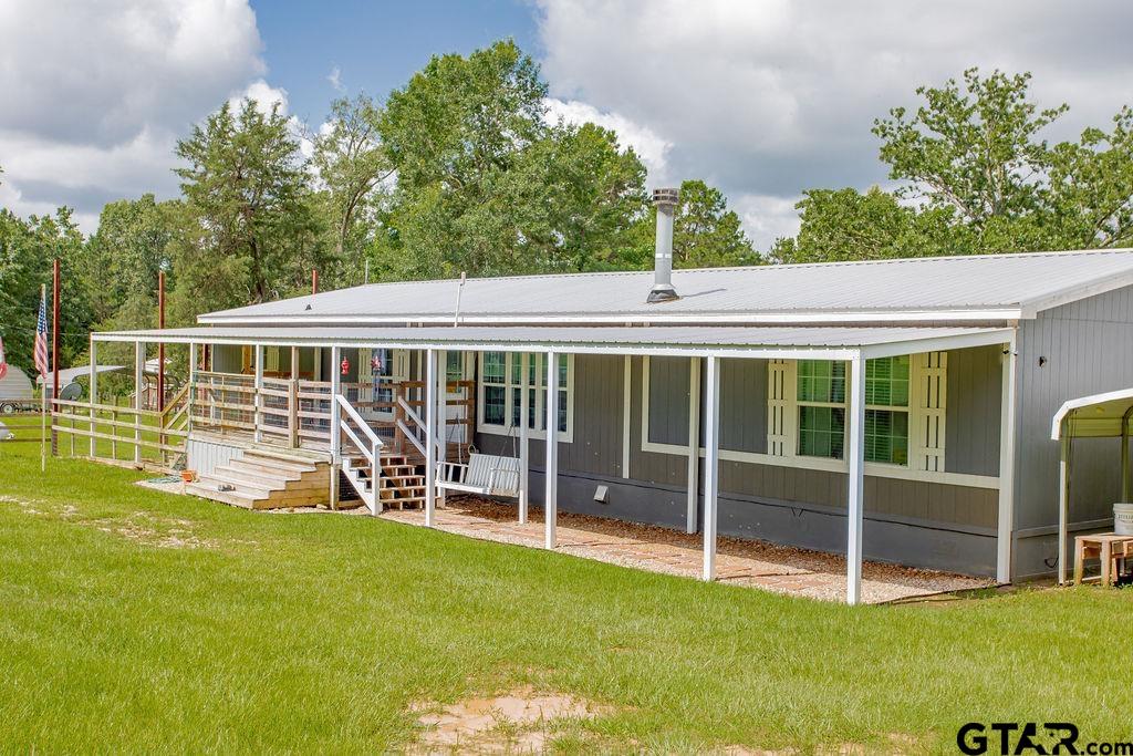 636 Roberson Road Hallsville, TX 75650 - Photo 2 of 46 a view of a house with a backyard