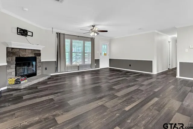 a kitchen with stainless steel appliances granite countertop hardwood floor sink stove and granite counter top