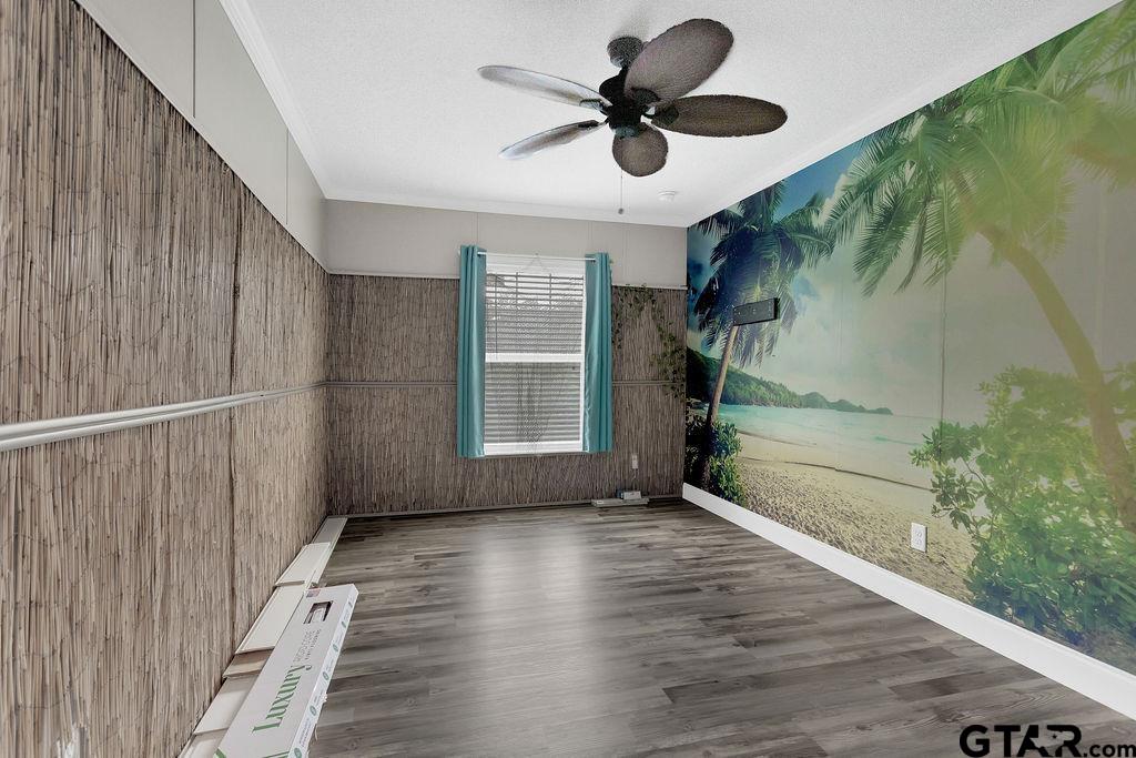 636 Roberson Road Hallsville, TX 75650 - Photo 34 of 46 a view of an empty room with a window and wooden floor