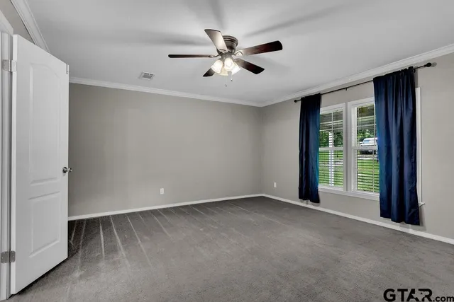 a spacious bathroom with a sink and a mirror