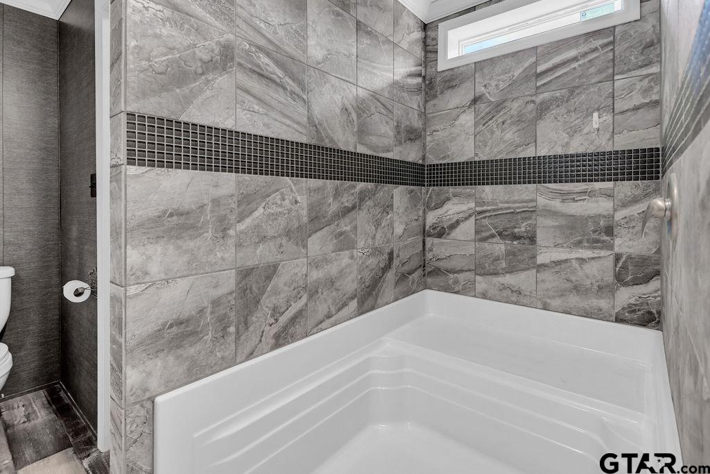 636 Roberson Road Hallsville, TX 75650 - Photo 41 of 46 a bathroom with a bathtub