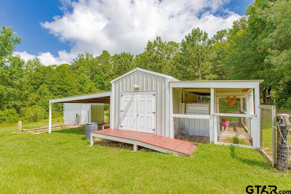 636 Roberson Road Hallsville, TX 75650 - Photo 46 of 46 a backyard of a house with table and chairs