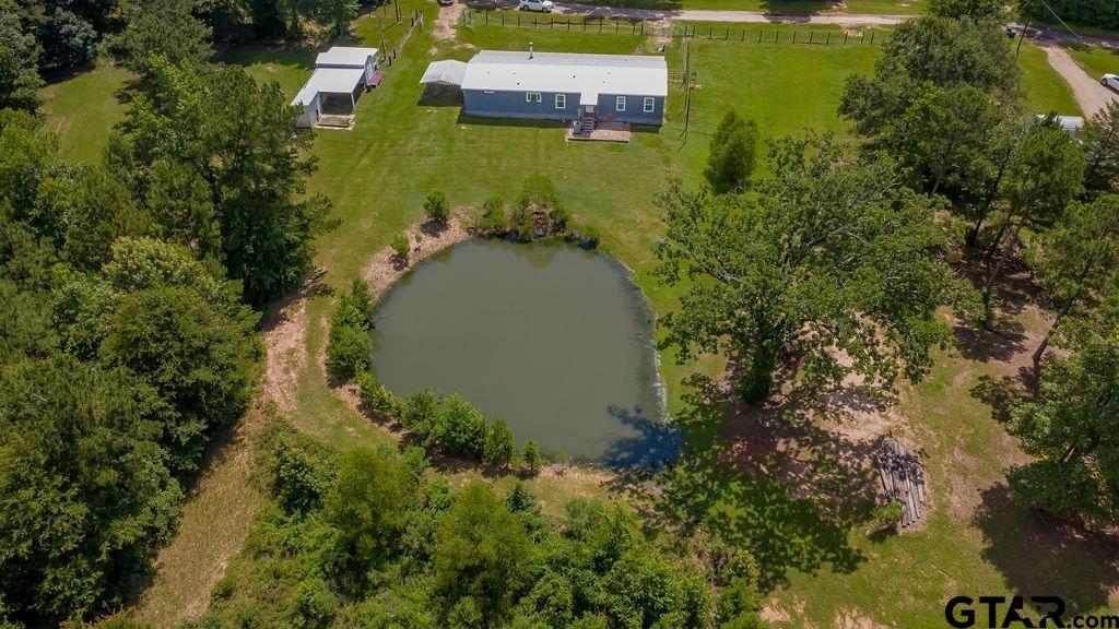 636 Roberson Road Hallsville, TX 75650 - Photo 5 of 46 an aerial view of residential house with outdoor space and trees all around