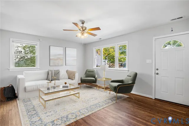 a living room with furniture and a window