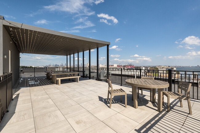 1 Flagship Street, Unit 219 Bayonne, NJ 07002 - Photo 11 of 15 a view of a swimming pool with seating area