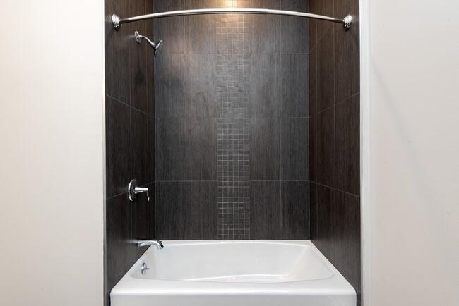 1 Flagship Street, Unit 219 Bayonne, NJ 07002 - Photo 5 of 15 a bathroom with a bathtub