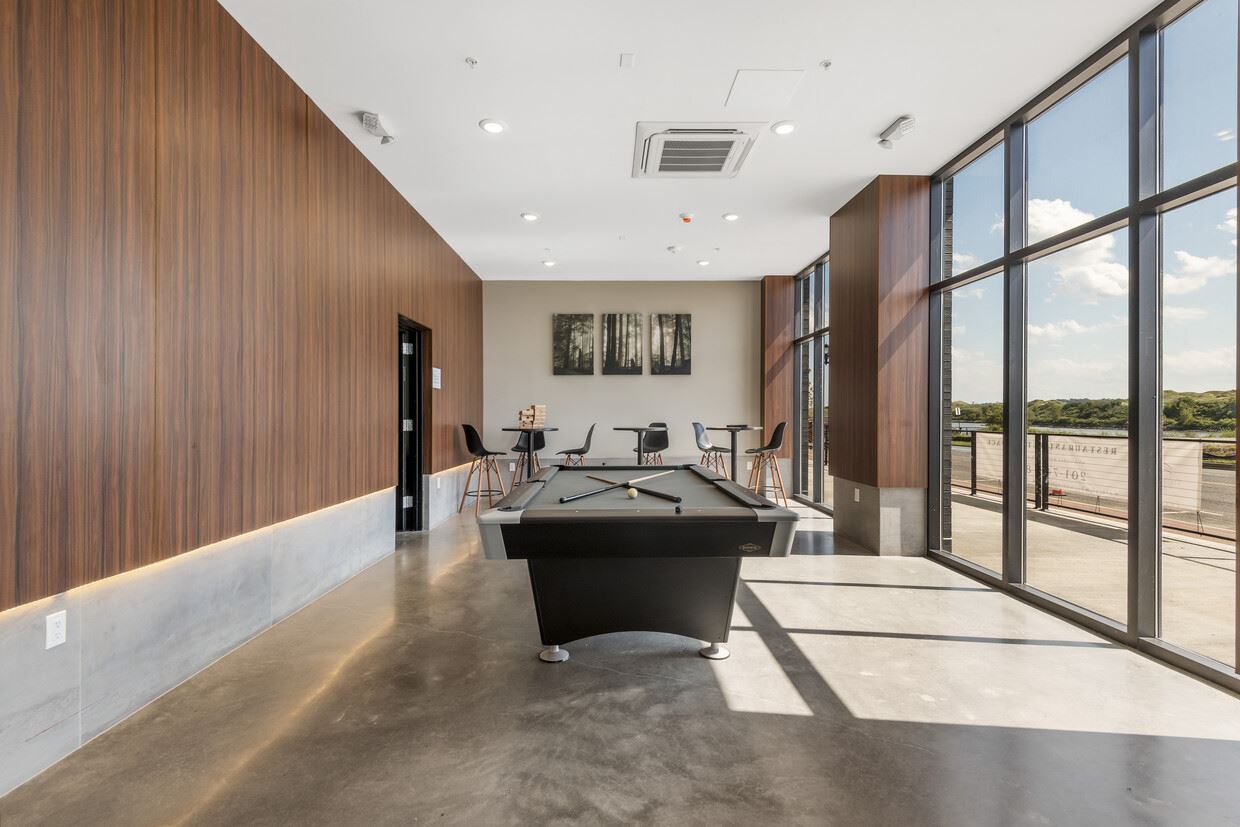 1 Flagship Street, Unit 219 Bayonne, NJ 07002 - Photo 9 of 15 a living room with furniture and a large window