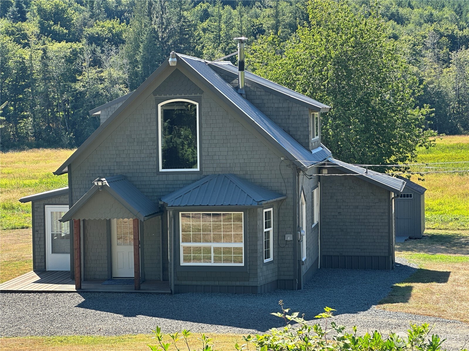 720 Leland Valley Road East Quilcene, WA 98376 - Photo 11 of 37 a front view of a house with yard