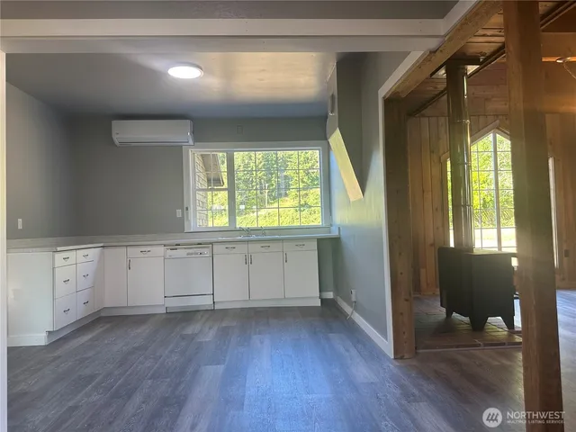 a room with window and wooden floor