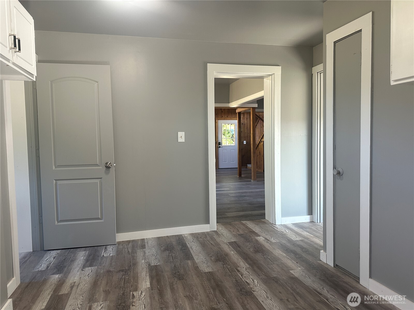 720 Leland Valley Road East Quilcene, WA 98376 - Photo 16 of 37 a view of a hallway with wooden floor and closet