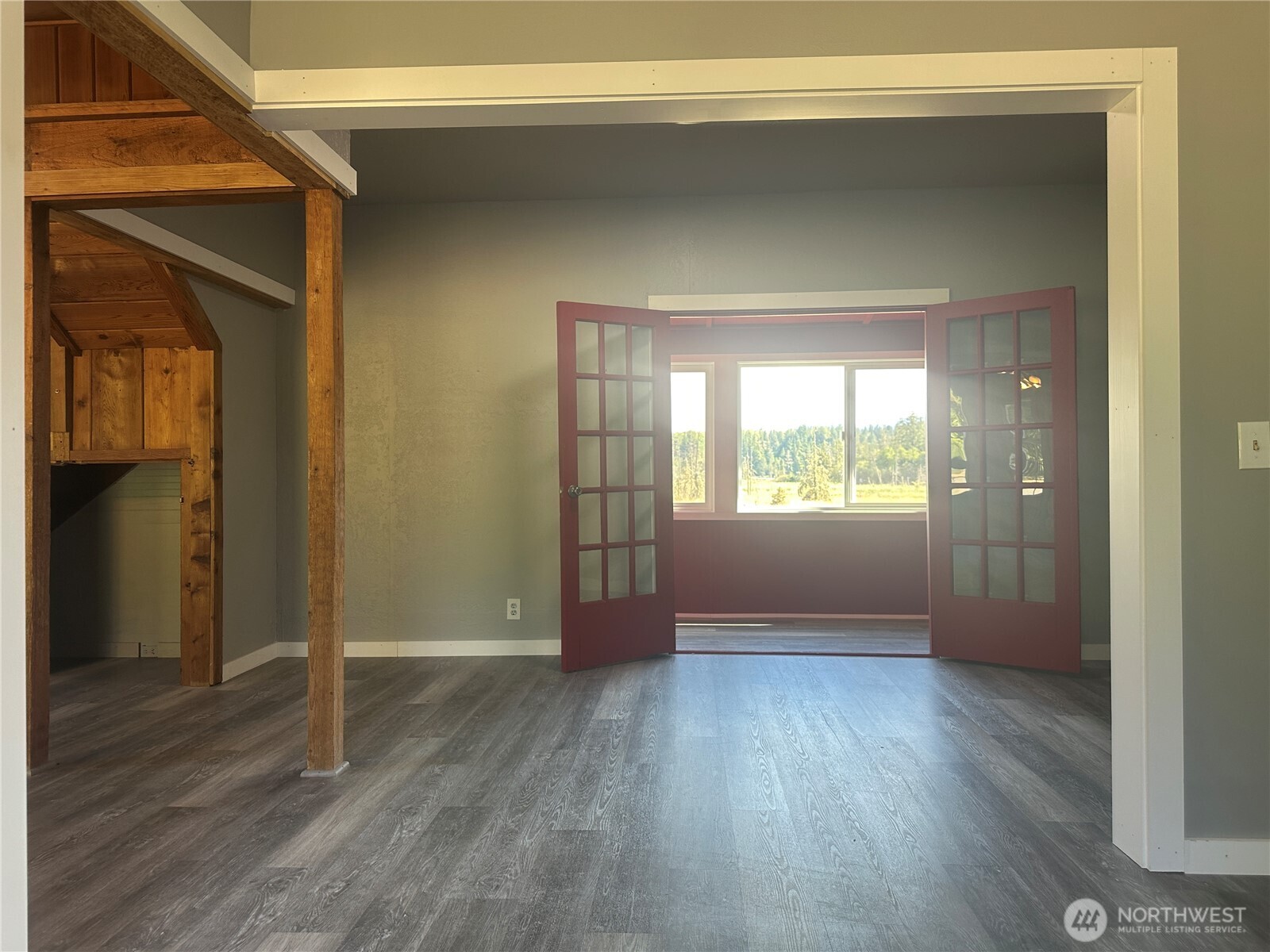 720 Leland Valley Road East Quilcene, WA 98376 - Photo 23 of 37 a view of wooden floor and windows in a room