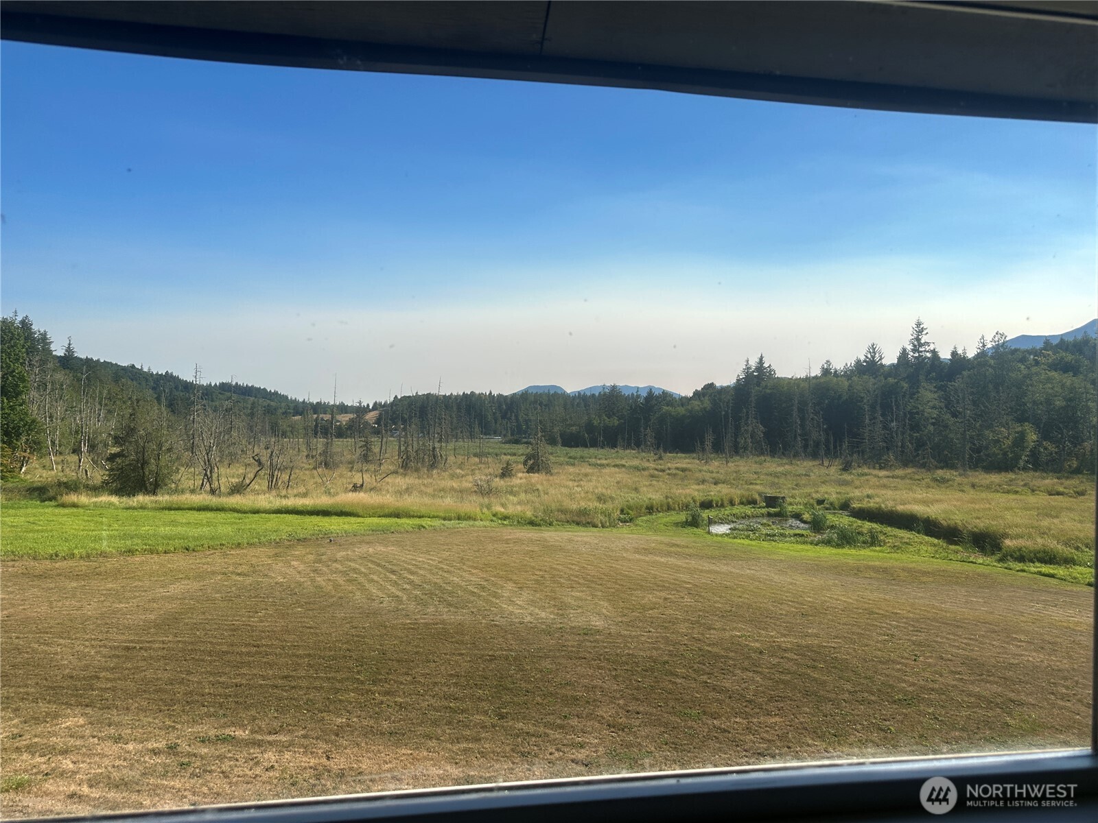 720 Leland Valley Road East Quilcene, WA 98376 - Photo 25 of 37 a view of an ocean from a balcony