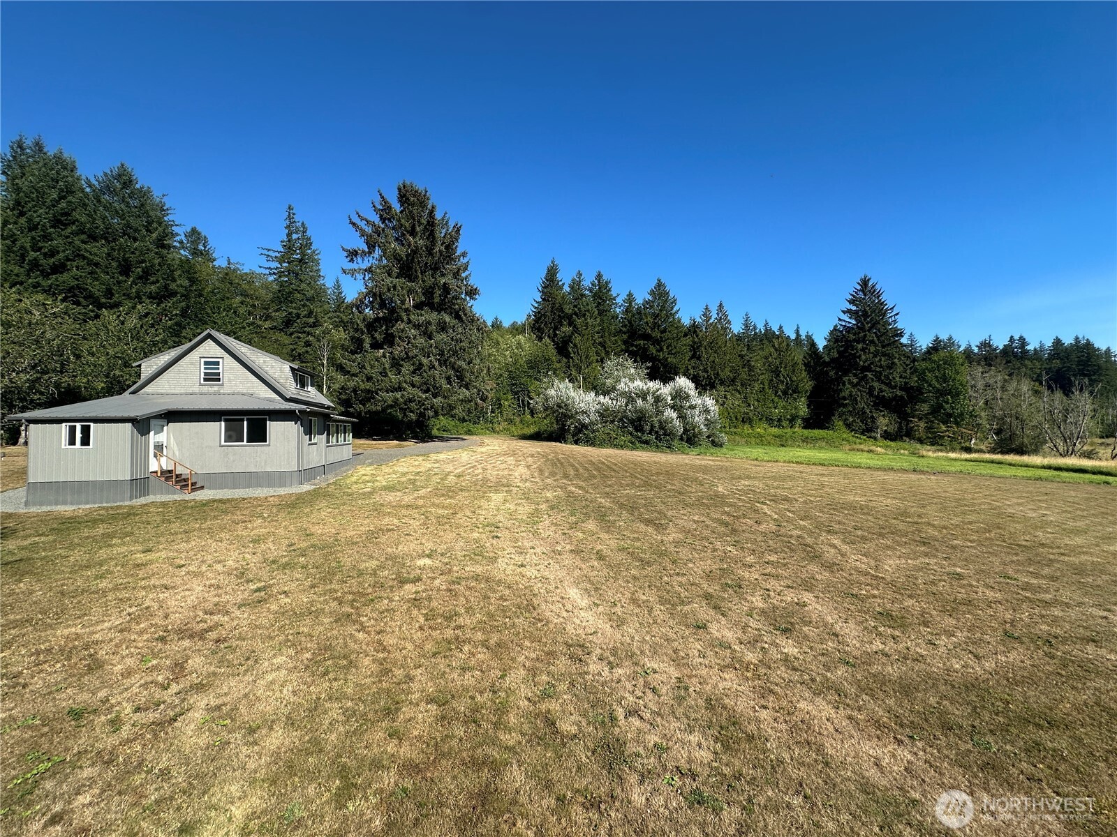 720 Leland Valley Road East Quilcene, WA 98376 - Photo 35 of 37 a front view of a house with a yard