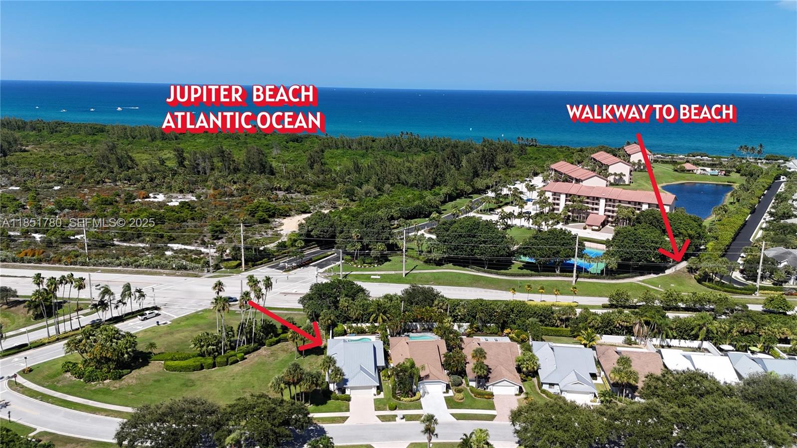 101 Sand Pine Drive, Unit 101 Jupiter, FL 33477 - Photo 1 of 33 a view of a street with an ocean view