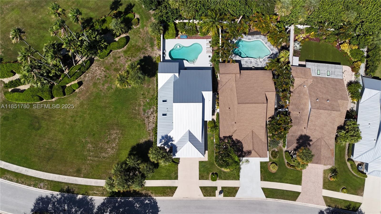 101 Sand Pine Drive, Unit 101 Jupiter, FL 33477 - Photo 2 of 33 an aerial view of a house with a yard