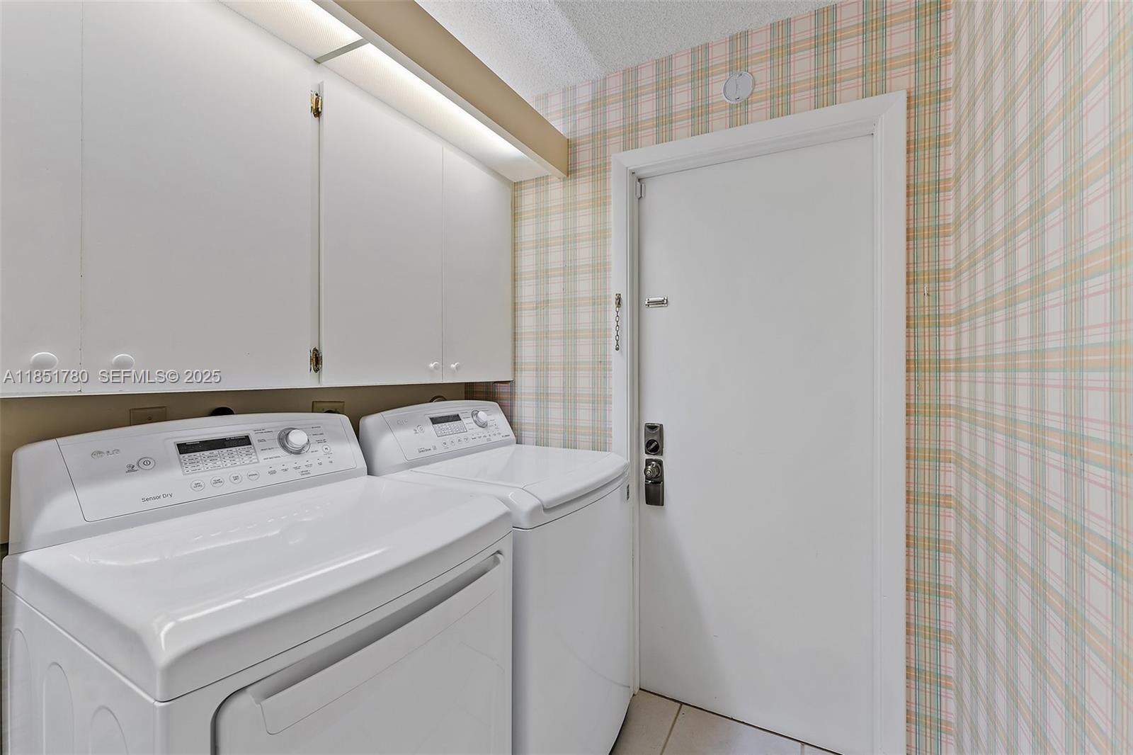 101 Sand Pine Drive, Unit 101 Jupiter, FL 33477 - Photo 26 of 33 a utility room with dryer and washer