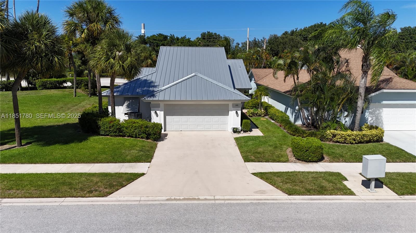 101 Sand Pine Drive, Unit 101 Jupiter, FL 33477 - Photo 33 of 33 front view of house with a yard