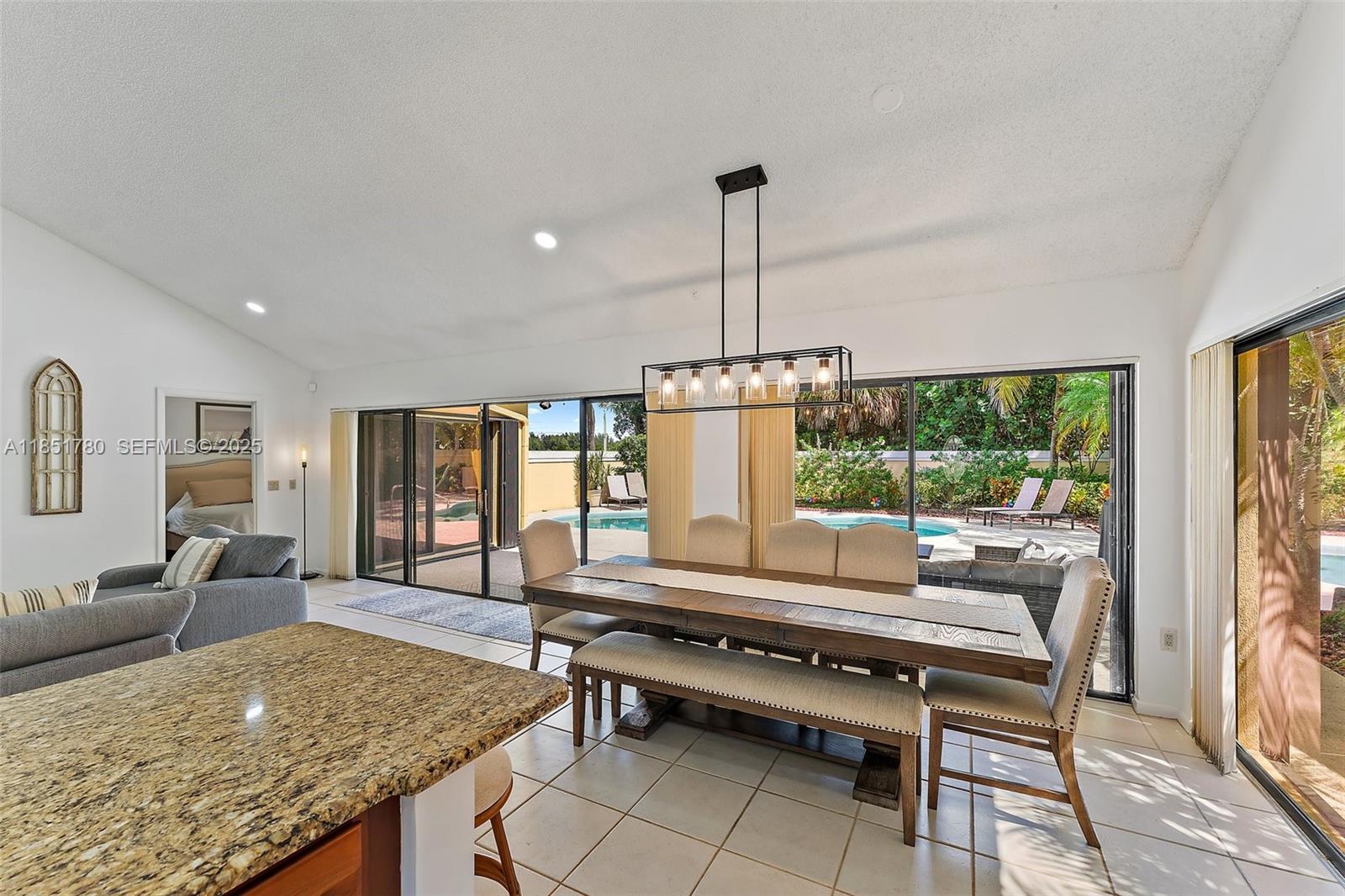 101 Sand Pine Drive, Unit 101 Jupiter, FL 33477 - Photo 6 of 33 a outdoor space with furniture and window