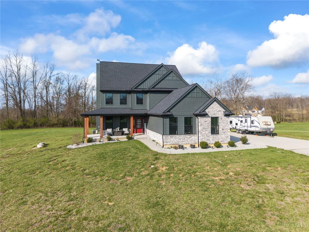 2425 Middleboro Road Clarksville, OH 45113 - Photo 5 of 91 This inviting home offers an exceptional blend of modern design and tranquil surroundings.