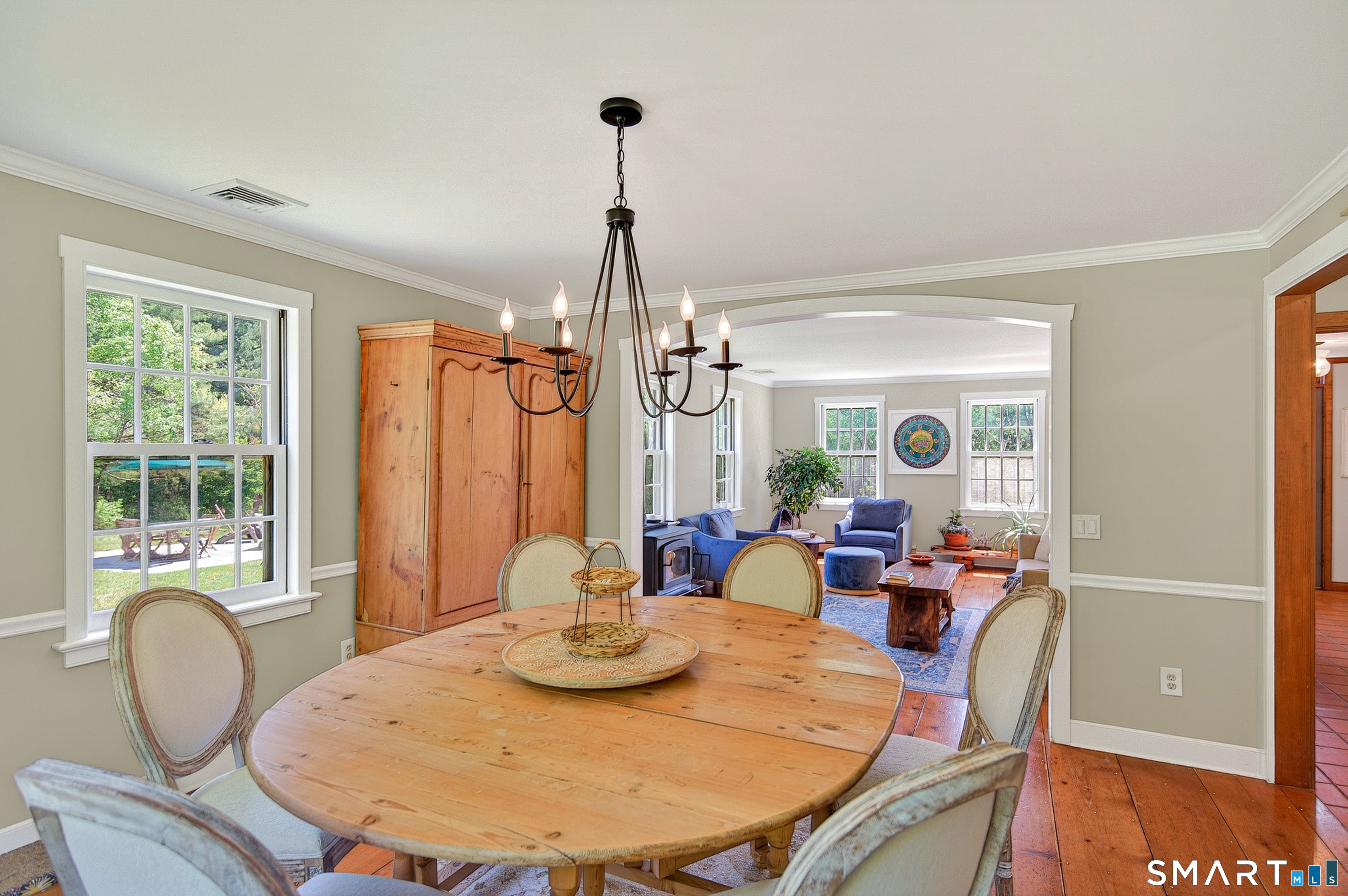 174 Huntingtown Road Newtown, CT 06470 - Photo 9 of 40 a dining room with furniture a window and wooden floor