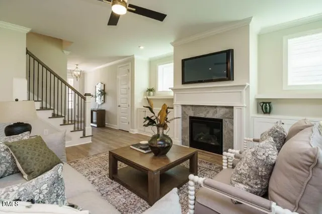 a living room with furniture fireplace and window