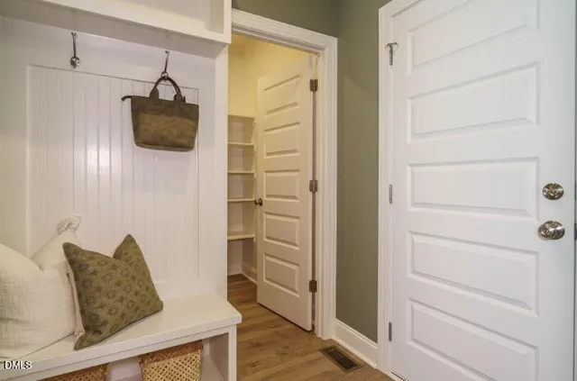 a bathroom with a glass shower door