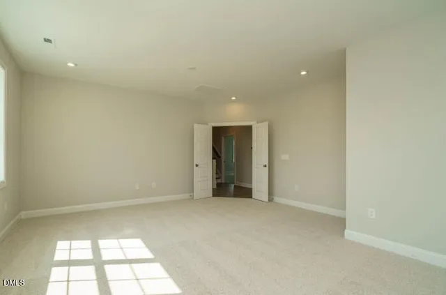 a bathroom with a sink a toilet and a large mirror