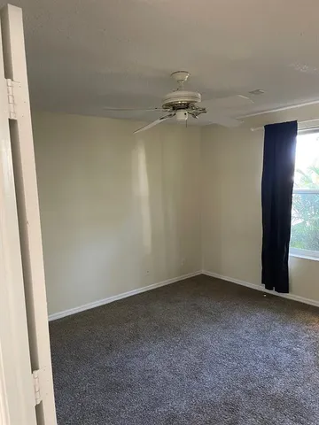 a view of a room with yard from balcony