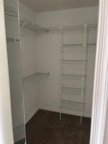 a bathroom with a tub and toilet