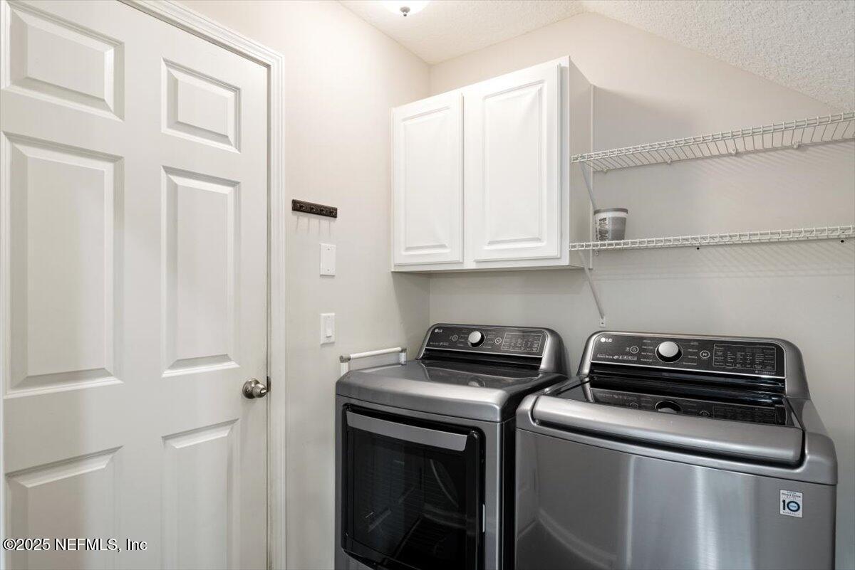 47 Myrtle Park Point Ponte Vedra, FL 32081 - Photo 14 of 58 a view of cabinets and washer dryer