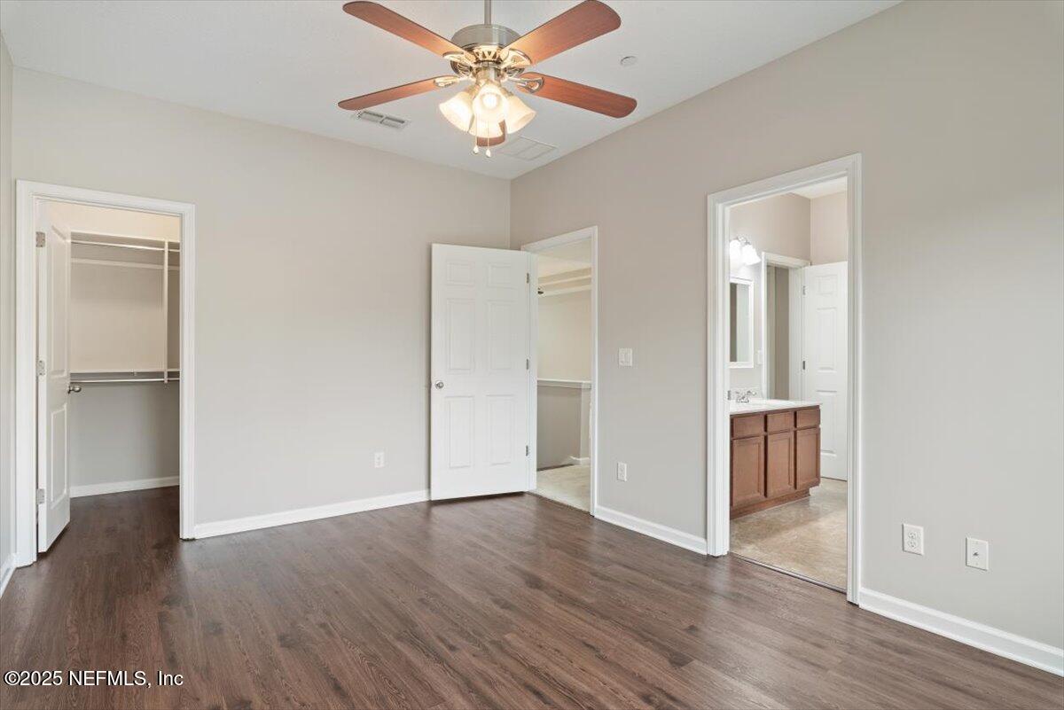 47 Myrtle Park Point Ponte Vedra, FL 32081 - Photo 31 of 58 an empty room with wooden floor and a ceiling fan