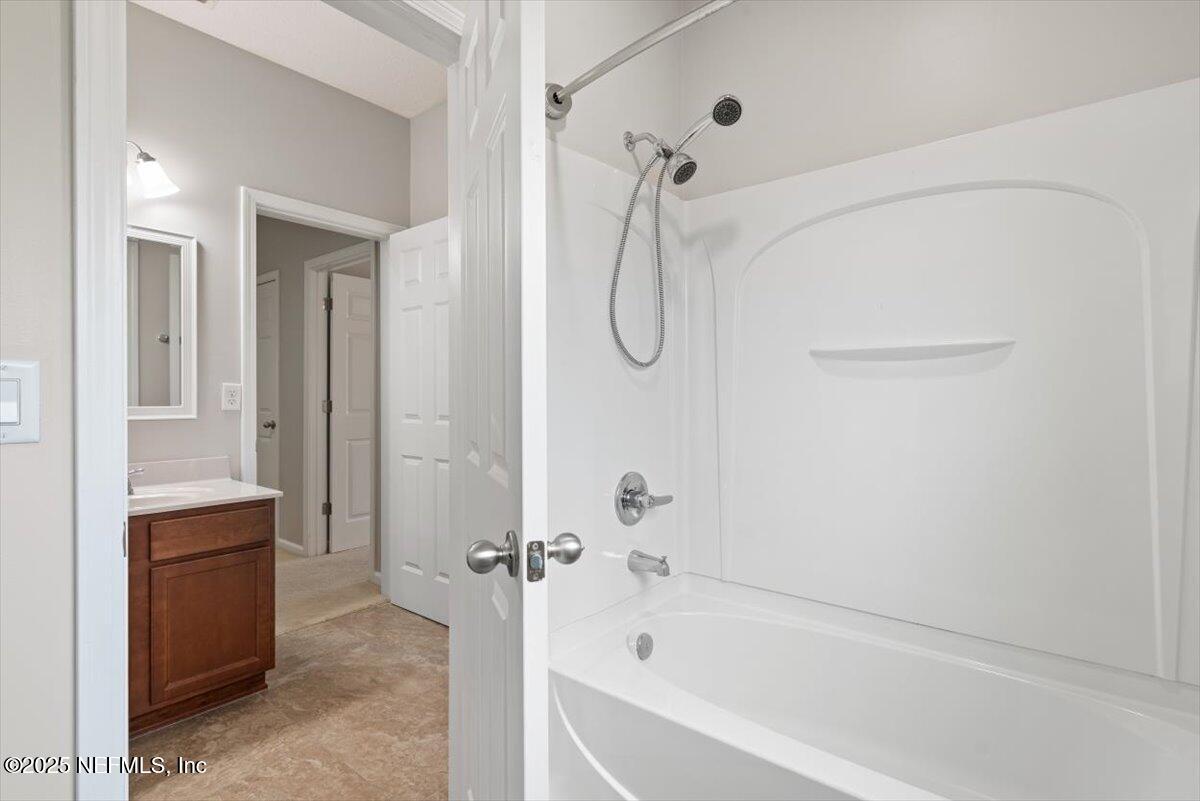 47 Myrtle Park Point Ponte Vedra, FL 32081 - Photo 33 of 58 a bathroom with a bathtub and a shower