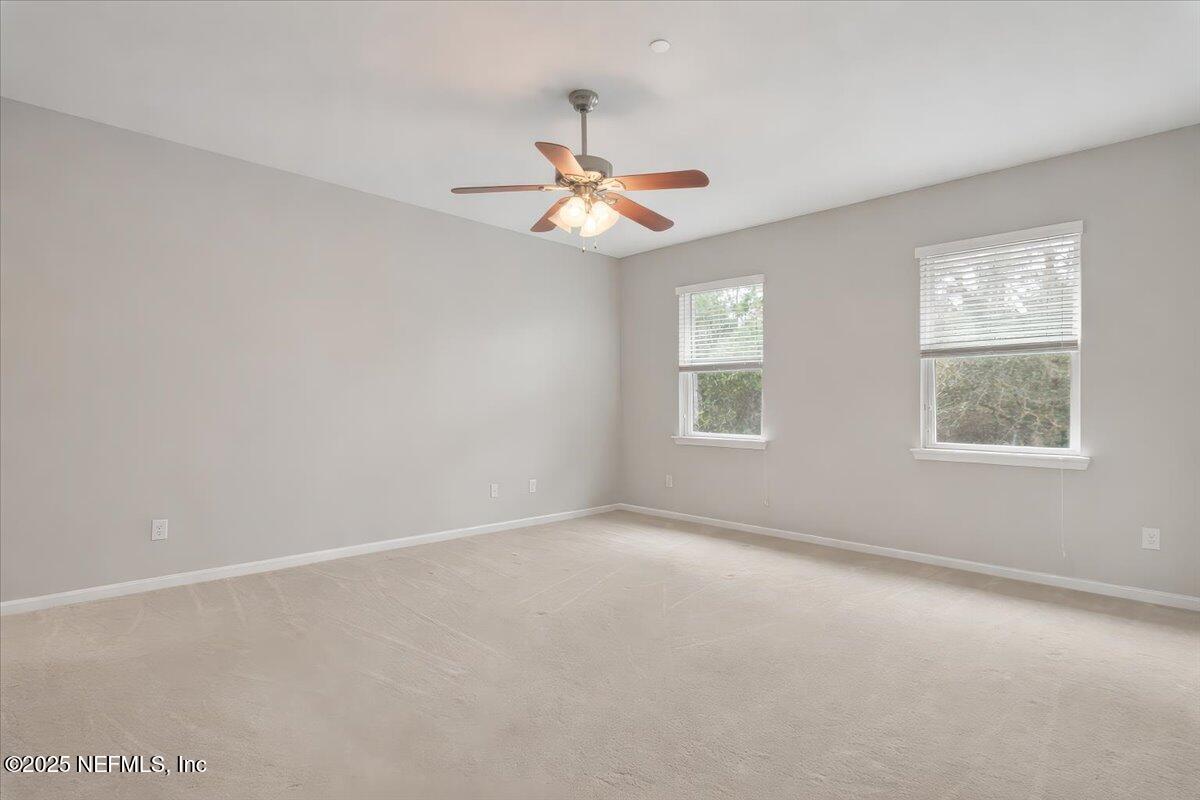 47 Myrtle Park Point Ponte Vedra, FL 32081 - Photo 37 of 58 an empty room with windows and fan