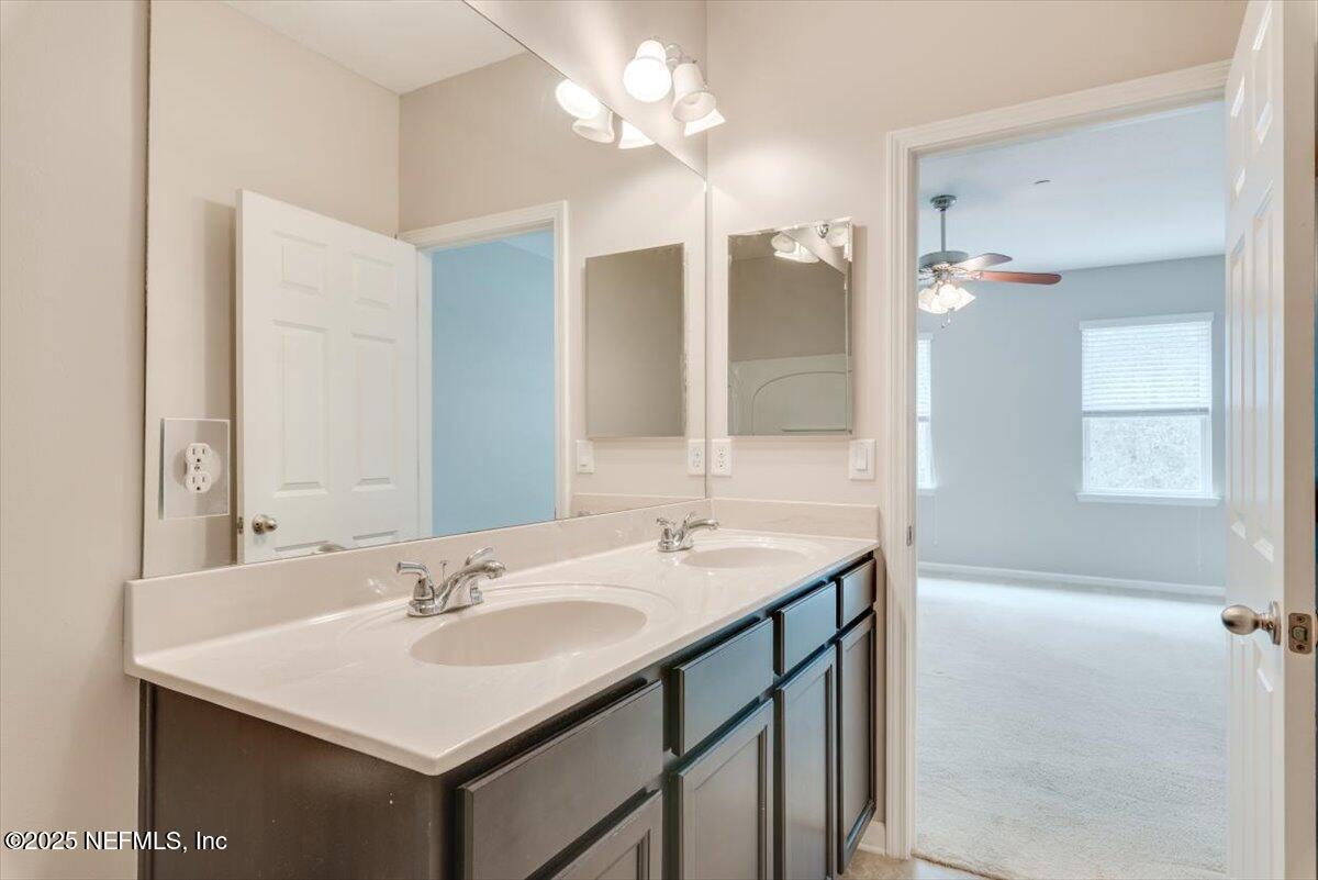 47 Myrtle Park Point Ponte Vedra, FL 32081 - Photo 39 of 58 a bathroom with a sink and a mirror