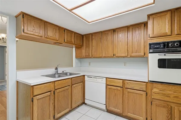 a kitchen with white cabinets