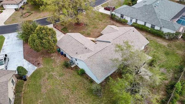 an aerial view of a house with yard