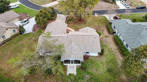 an aerial view of a house with a garden