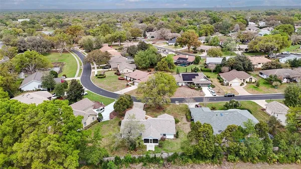 an aerial view of house with yard swimming pool and outdoor seating