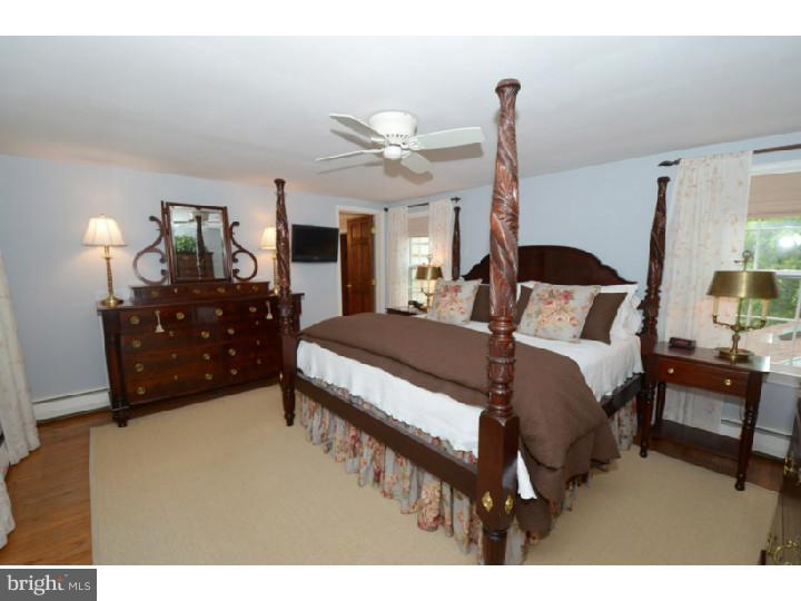 642 Mount View Road Berwyn, PA 19312 - Photo 14 of 25 a bedroom with a bed window and a lamp