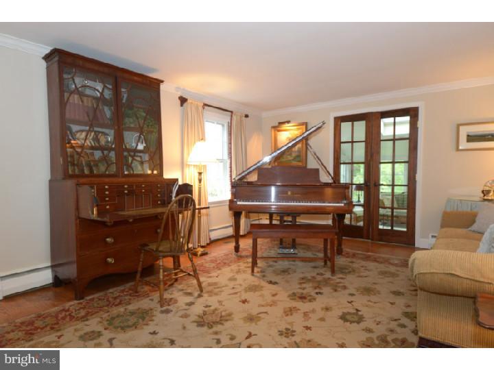 642 Mount View Road Berwyn, PA 19312 - Photo 3 of 25 a living room with furniture and a floor to ceiling window