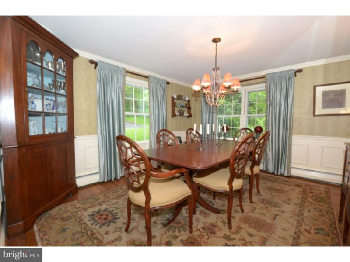 642 Mount View Road Berwyn, PA 19312 - Photo 4 of 25 a view of a dining room with furniture large windows and wooden floor