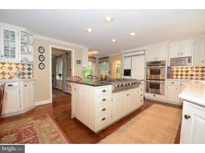 642 Mount View Road Berwyn, PA 19312 - Photo 8 of 25 a large white kitchen with stainless steel appliances
