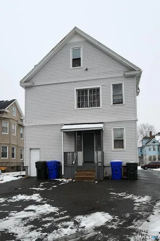 a kitchen with cabinets and wooden floor