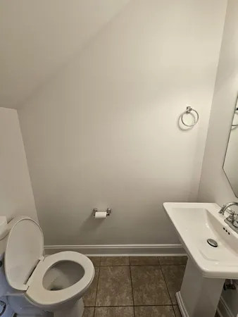 a bathroom with a sink a toilet