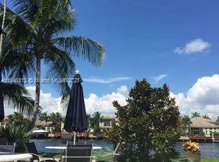 a view of a palm tree next to a building