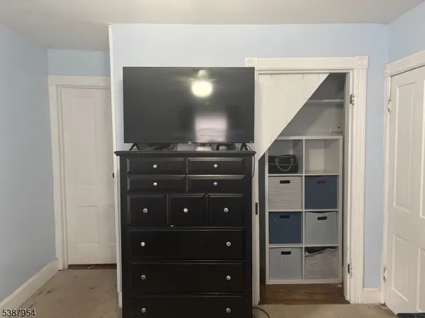 a view of a hallway with washer and dryer