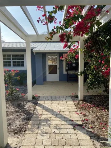 a view of a room with a flower garden