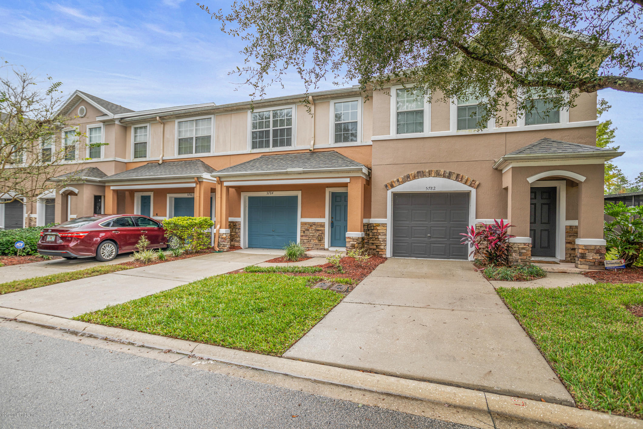 5784 Sandstone Way Jacksonville, FL 32258 - Photo 11 of 29 front view of a brick house with a yard